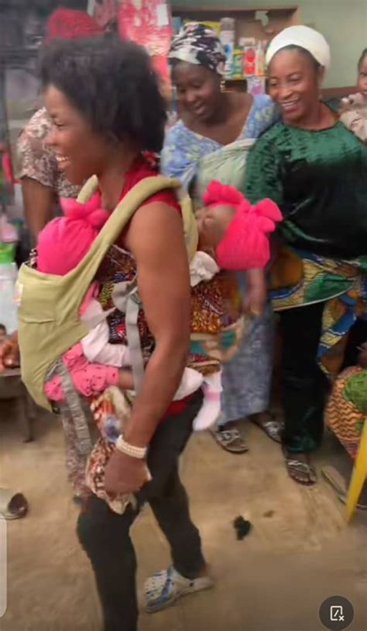Grown-up Lady Jumps on African Mother's Back, Plays with Her in Kitchen, Video Stirs Reactions