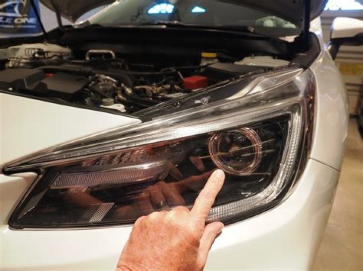 How do you adjust the headlights on a 2016 Nissan Altima?