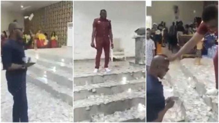 Man “Chokes” His Pastor With Money As He Sprays Him Hard Currency on the Altar in Viral Video